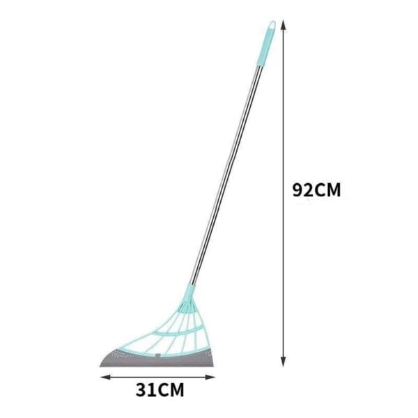 Un rastrillo de hojas verde azulado y gris con indicación de medidas que muestra una longitud total de 92 cm y una anchura de 31 cm.