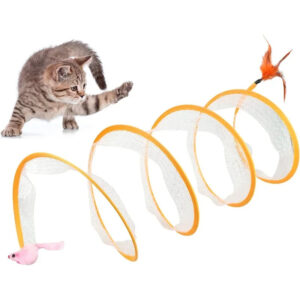 A playful kitten is reaching out its paw toward a spiral-shaped cat toy. The toy has a clear, coiled structure with an orange edge and features a pink mouse at one end and an orange feather at the other.