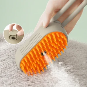 A hand holding a grey and orange pet grooming brush with soft silicone bristles and a built-in button for dispensing shampoo, illustrated in the inset. The brush is being used on the fur of a light-colored pet, creating a lather with water droplets visible.